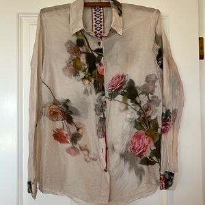 Button down blouse with shades of pink, rose, apricot roses and green leaves.